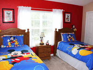 Mickey Themed Room has 2 twin beds and an extra twin mattress for added flexibility