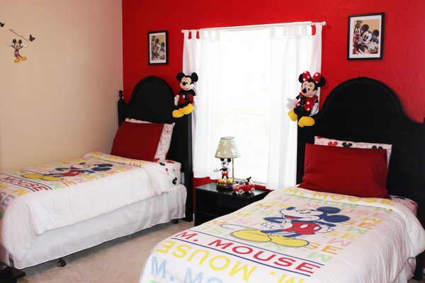 Mickey Themed Room has 2 twin beds and an extra twin mattress for added flexibility